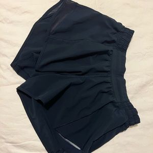 Hotty Hot Low-Rise Lined Short 2.5". Size: 6. Color: True Navy.